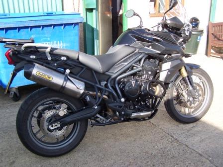Starved of fuel, the Tiger 800 needs remapping after the addition of exhaust cans.